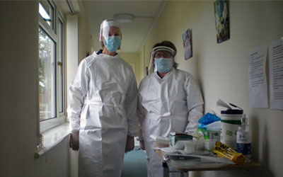 Staff in full PPE